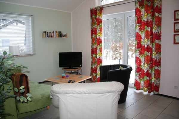 Foto van Bungalow bij Eifel Skilift - Vakantiehuis in Hinterhausen - Gerolstein - LivingRoom