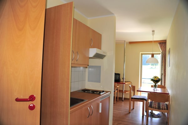 Foto van Appartement met all-inclusive arrangement en zwembad - Kitchen