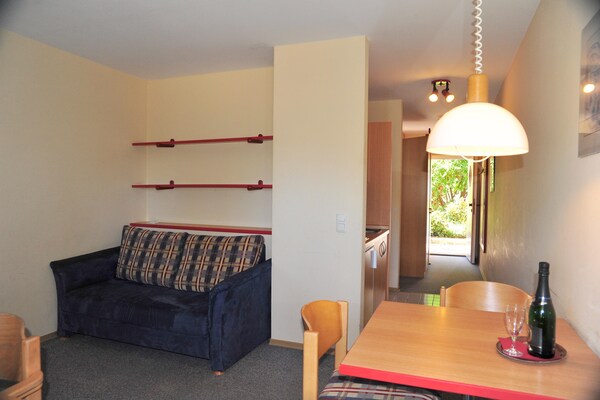 Foto van Appartement met all-inclusive arrangement en zwembad - LivingRoom