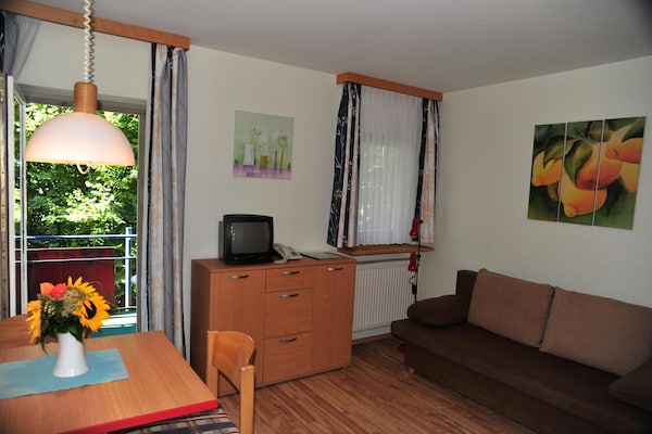 Foto van Appartement met all-inclusive arrangement en zwembad - LivingRoom