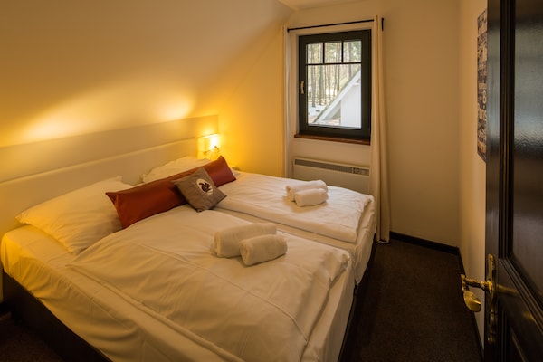 Foto van Twee-onder-een-kapwoningen in het natuurresort Drewitz - BedRoom