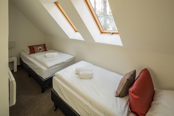 Foto van Twee-onder-een-kapwoningen in het natuurresort Drewitz - BedRoom