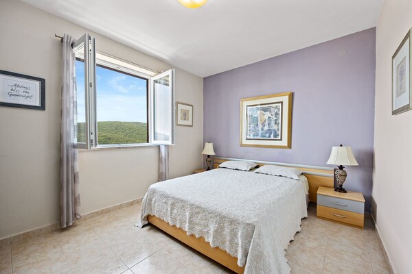 Foto van Appartement met zeezicht in Rabac - Vakantiehuis in Rabac - BedRoom