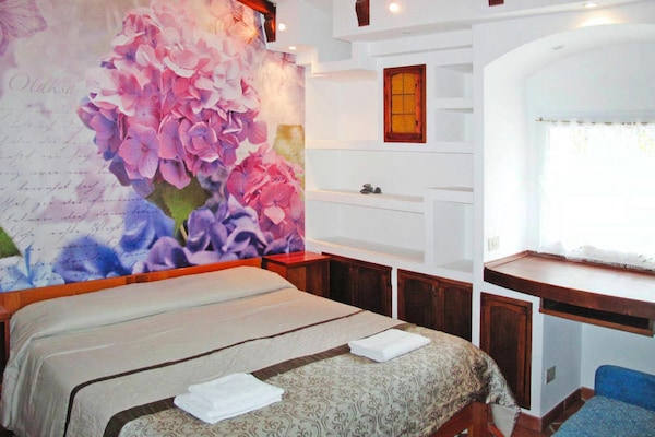 Foto van Appartement in Imperia met gemeenschappelijk zwembad - BedRoom