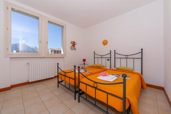 Foto van Appartement in Porlezza met balkon of tuin-voorheen TUI Ferienhaus - BedRoom
