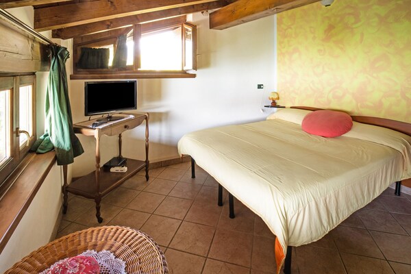 Foto van Cottage in Parole bij bos en meer - Vakantiehuis in Idro - BedRoom