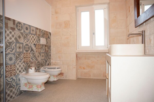 Foto van Torenhuis in Puglia met zwembad en uitzicht - Vakantiehuis in Cisternino - BathRoom