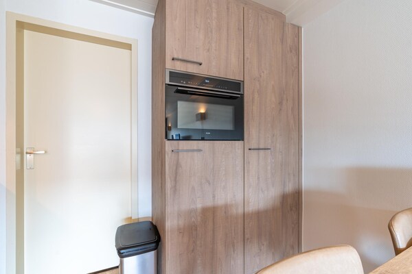 Foto van Comfortabel en modern ingericht 4-persoons appartement - Kitchen