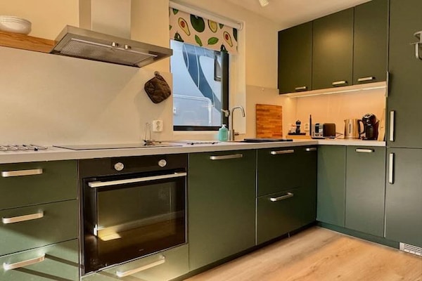 Foto van Bosretraite met zonneoplader - Vakantiehuis in Ewijk - Kitchen