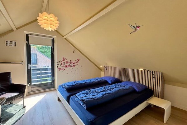 Foto van Bosretraite met zonneoplader - Vakantiehuis in Ewijk - BedRoom