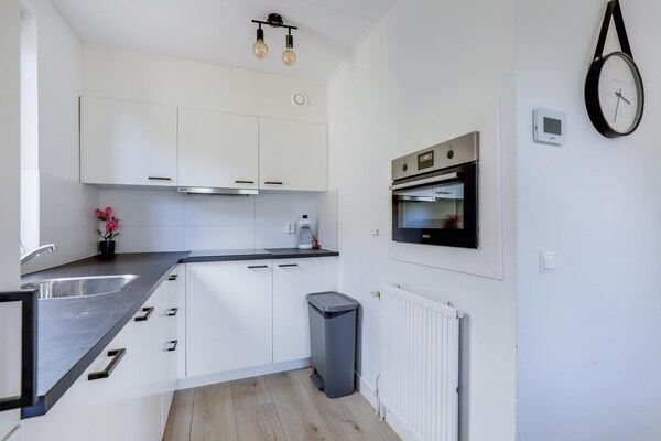 Foto van Bungalow aan het meer met tuin, geschikt voor 6 - Vakantiehuis in Ewijk - Kitchen