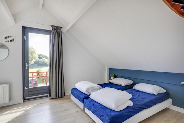 Foto van Bungalow aan het meer met tuin, geschikt voor 6 - Vakantiehuis in Ewijk - BedRoom