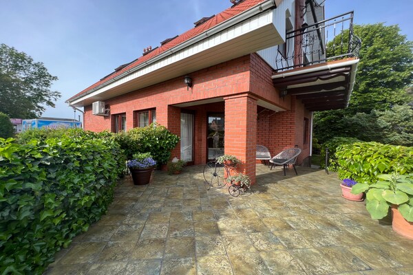 Foto van Vakantiehuis in Ustronie Morskie bij Strand - Vakantiehuis in Ustronie Morskie - TerraceBalcony