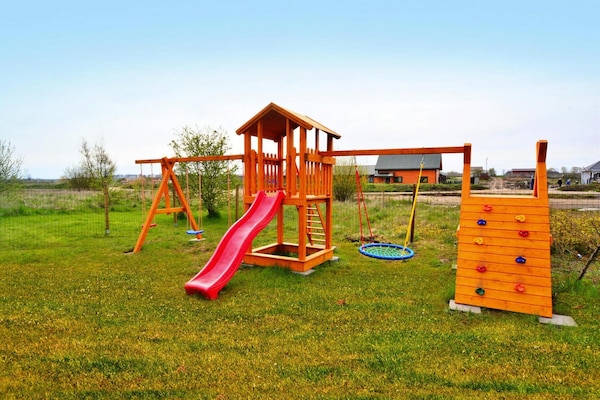Foto van Appartement vlakbij het strand en een speeltuin - Vakantiehuis in Sarbinowo - GardenSummer