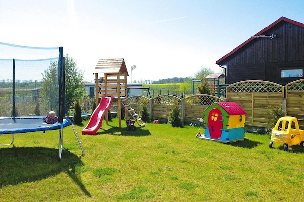 Foto van Appartement vlakbij het strand en een speeltuin - Vakantiehuis in Sarbinowo - GardenSummer